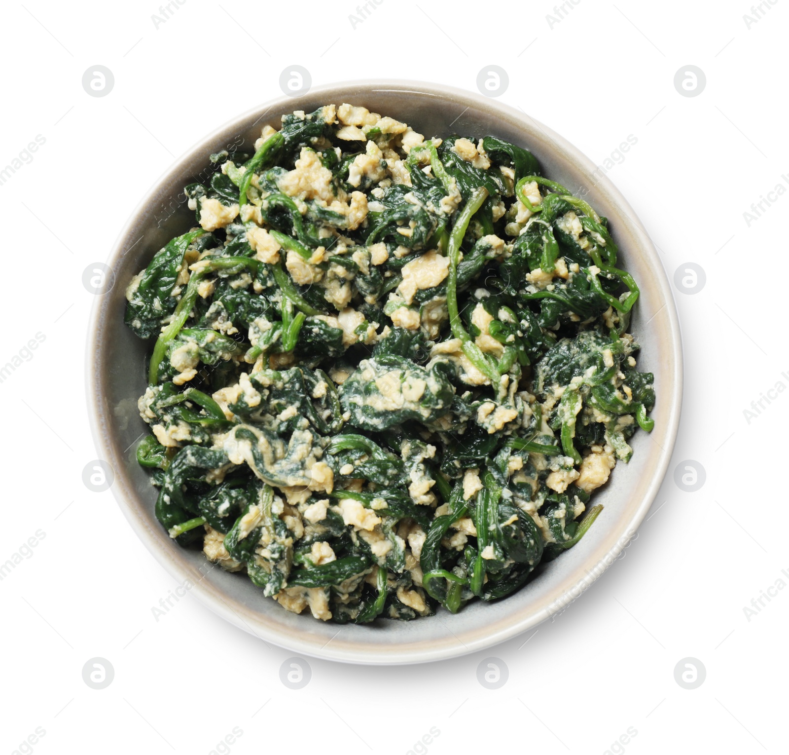 Photo of Tasty spinach dip with egg in bowl isolated on white, top view