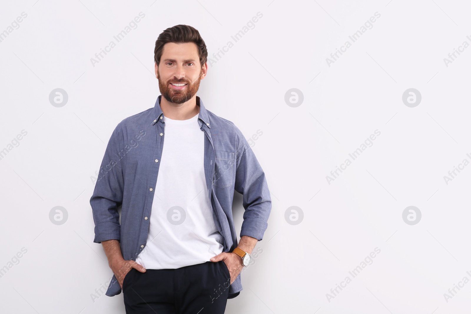 Photo of Portrait of handsome man on white background, space for text