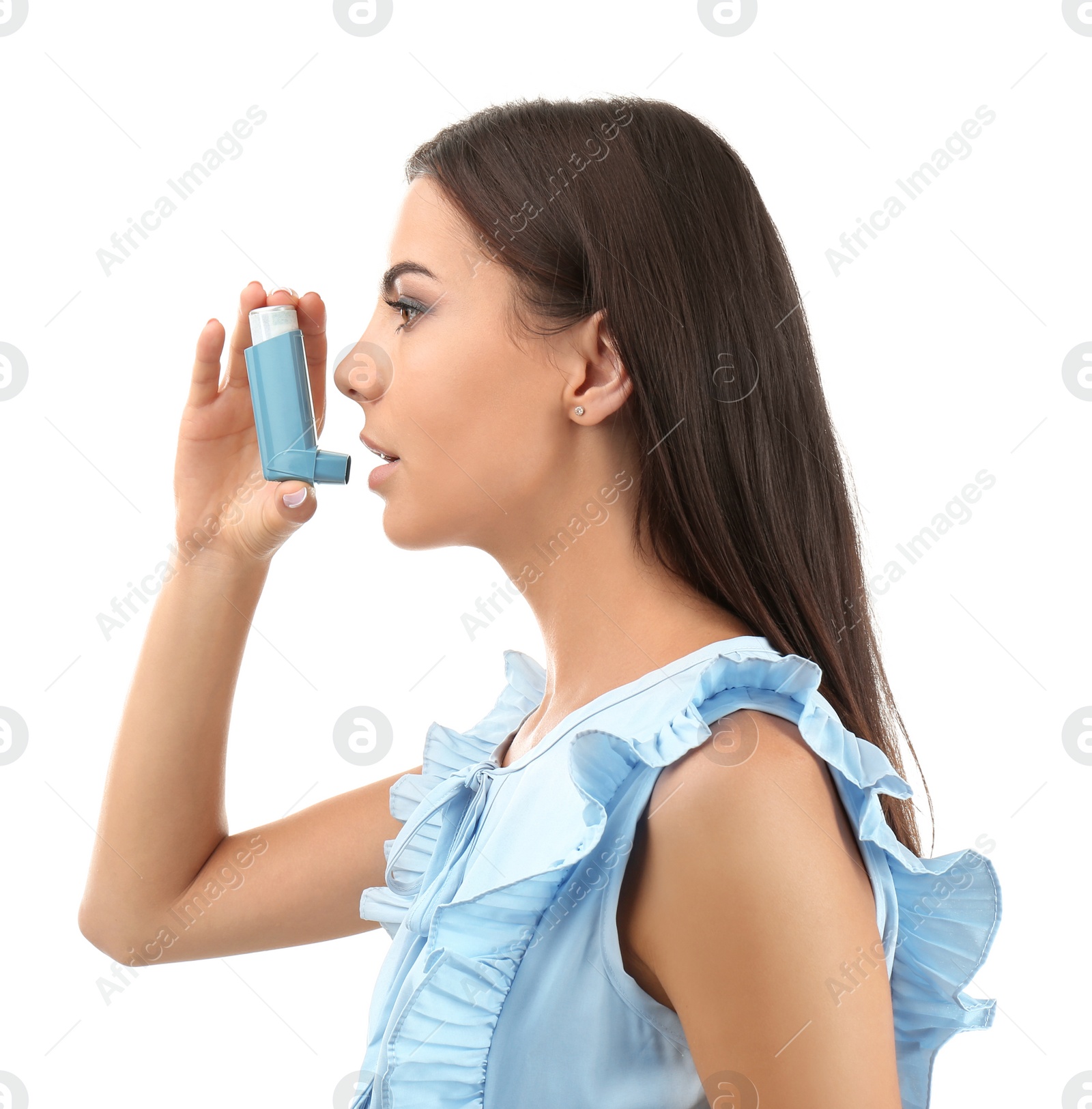 Photo of Young woman using asthma inhaler on white background