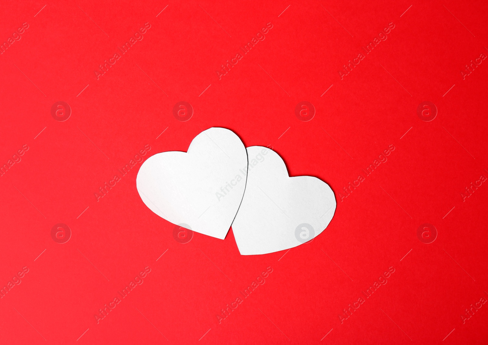 Photo of Paper hearts on color background, top view