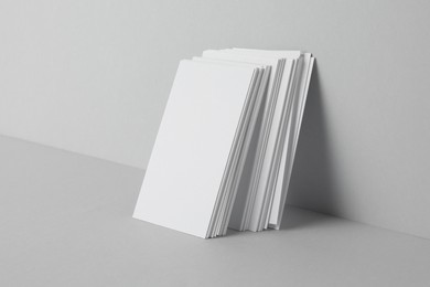 Blank business cards on light gray background. Mockup for design