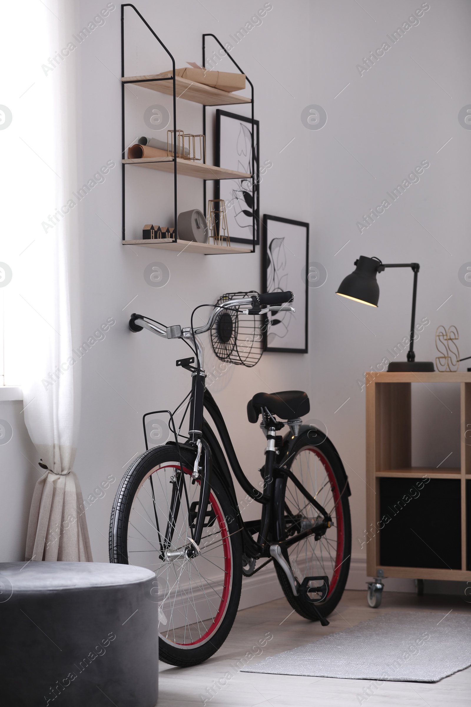 Photo of Stylish room with modern bicycle. Idea for interior decor