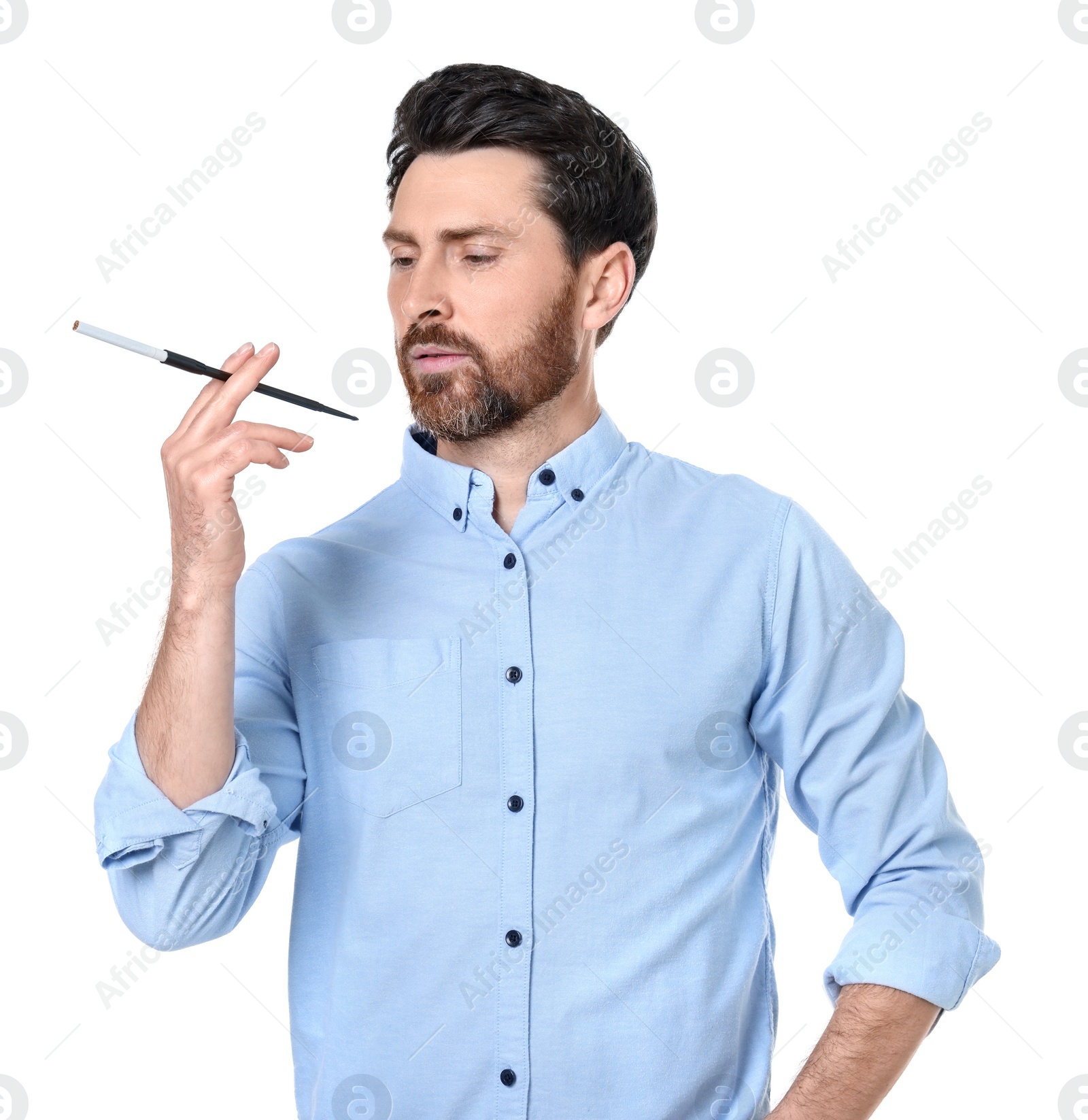 Photo of Man using long cigarette holder for smoking isolated on white