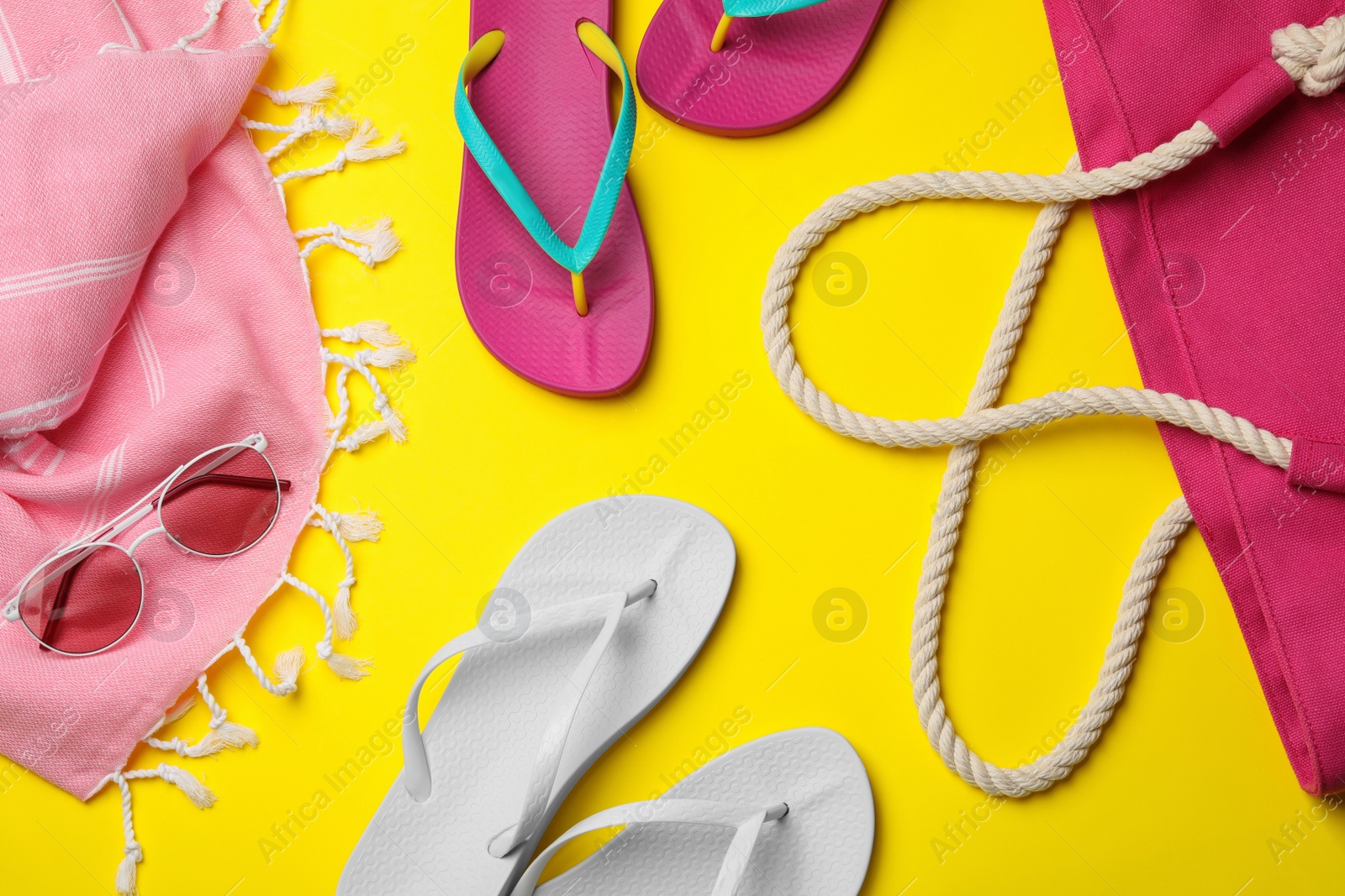 Photo of Flat lay composition with beach accessories on color background