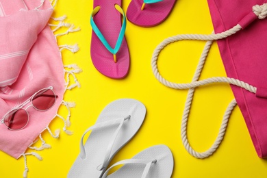 Photo of Flat lay composition with beach accessories on color background