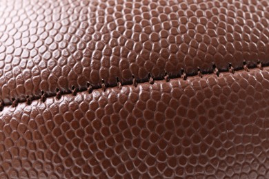 Photo of Leather rugby ball as background, closeup view