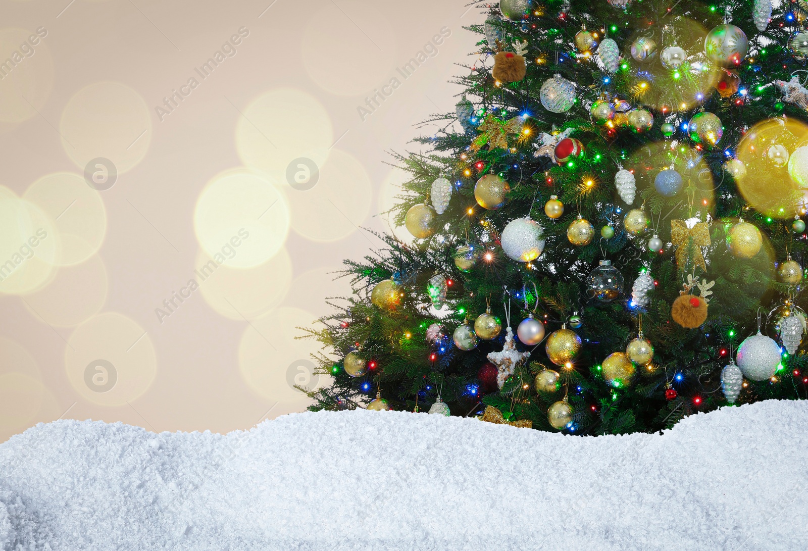 Image of Beautifully decorated Christmas tree and snow on light background, space for text. Bokeh effect