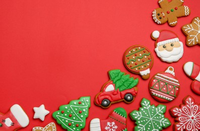 Photo of Different tasty Christmas cookies on red background, flat lay. Space for text