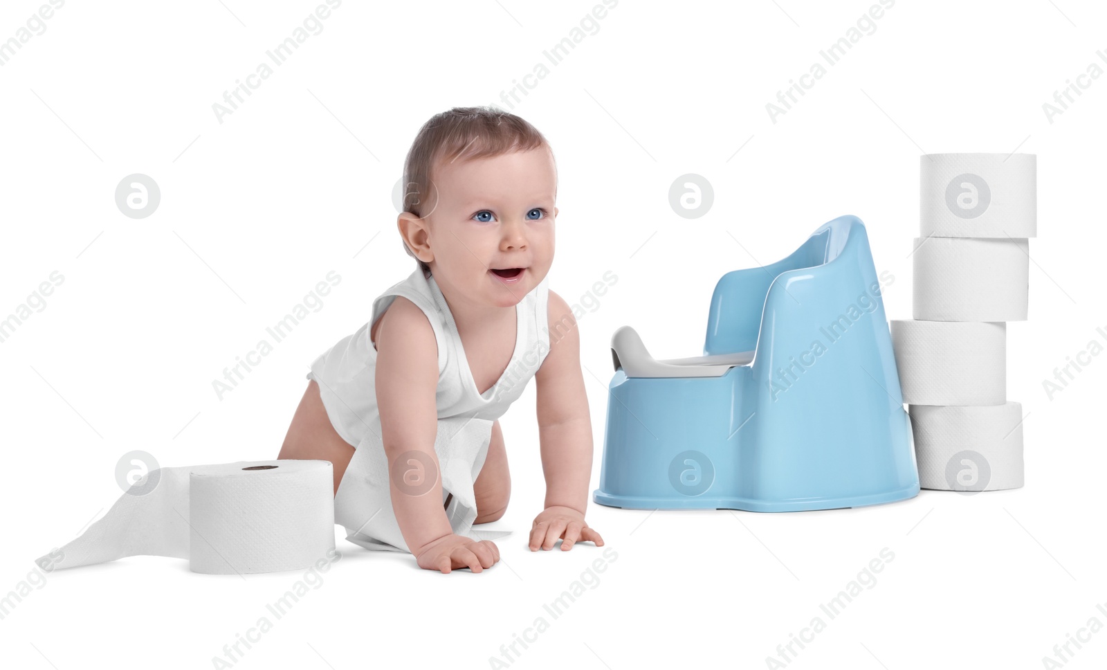 Photo of Little child near baby potty and stack of toilet paper rolls on white background