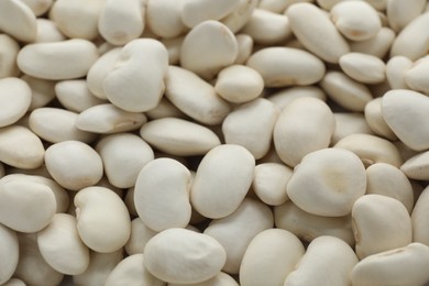 Photo of Pile of uncooked white beans as background, closeup
