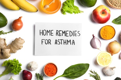 Natural products and paper with text HOME REMEDIES FOR ASTHMA on white background, top view