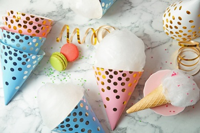Photo of Composition with cotton candy treats on marble background, top view