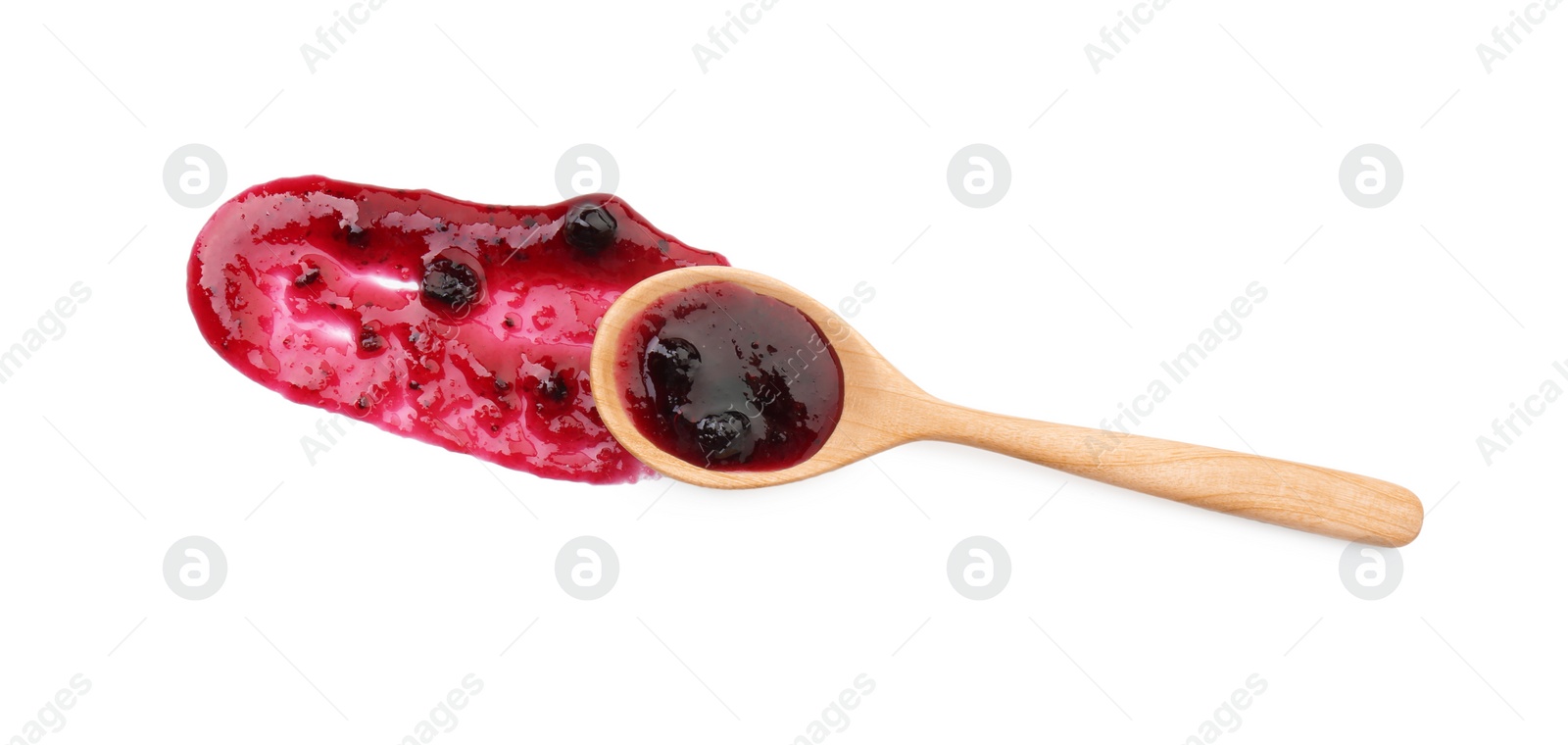Photo of Tasty sweet jam and spoon isolated on white, top view