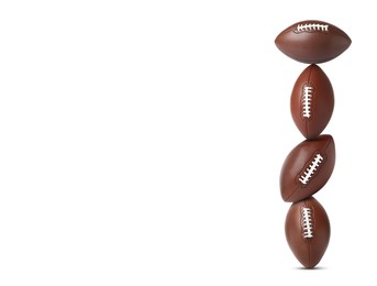 Image of Stack of American football balls on white background. Space for text