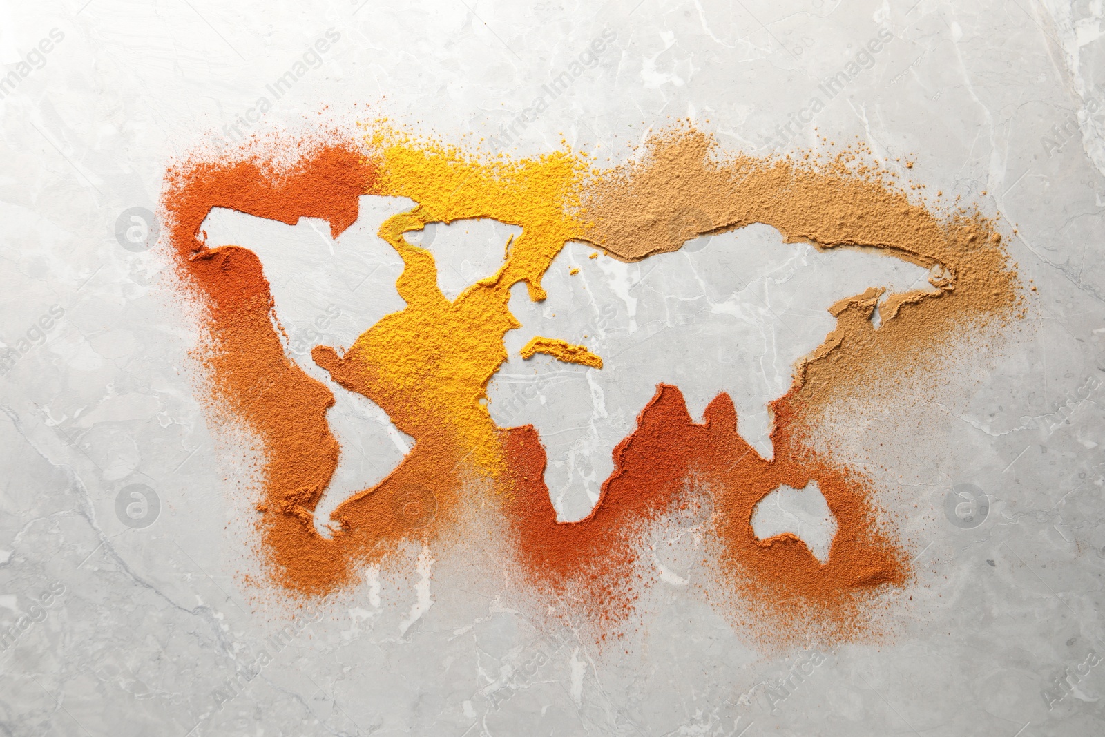 Photo of World map of different spices on light grey marble table, flat lay