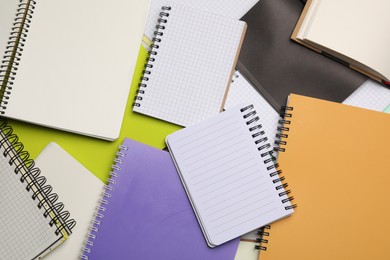 Many different notebooks as background, top view