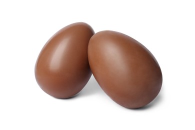 Photo of Two tasty chocolate eggs isolated on white