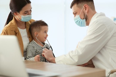 Photo of Mother and son visiting pediatrician in hospital