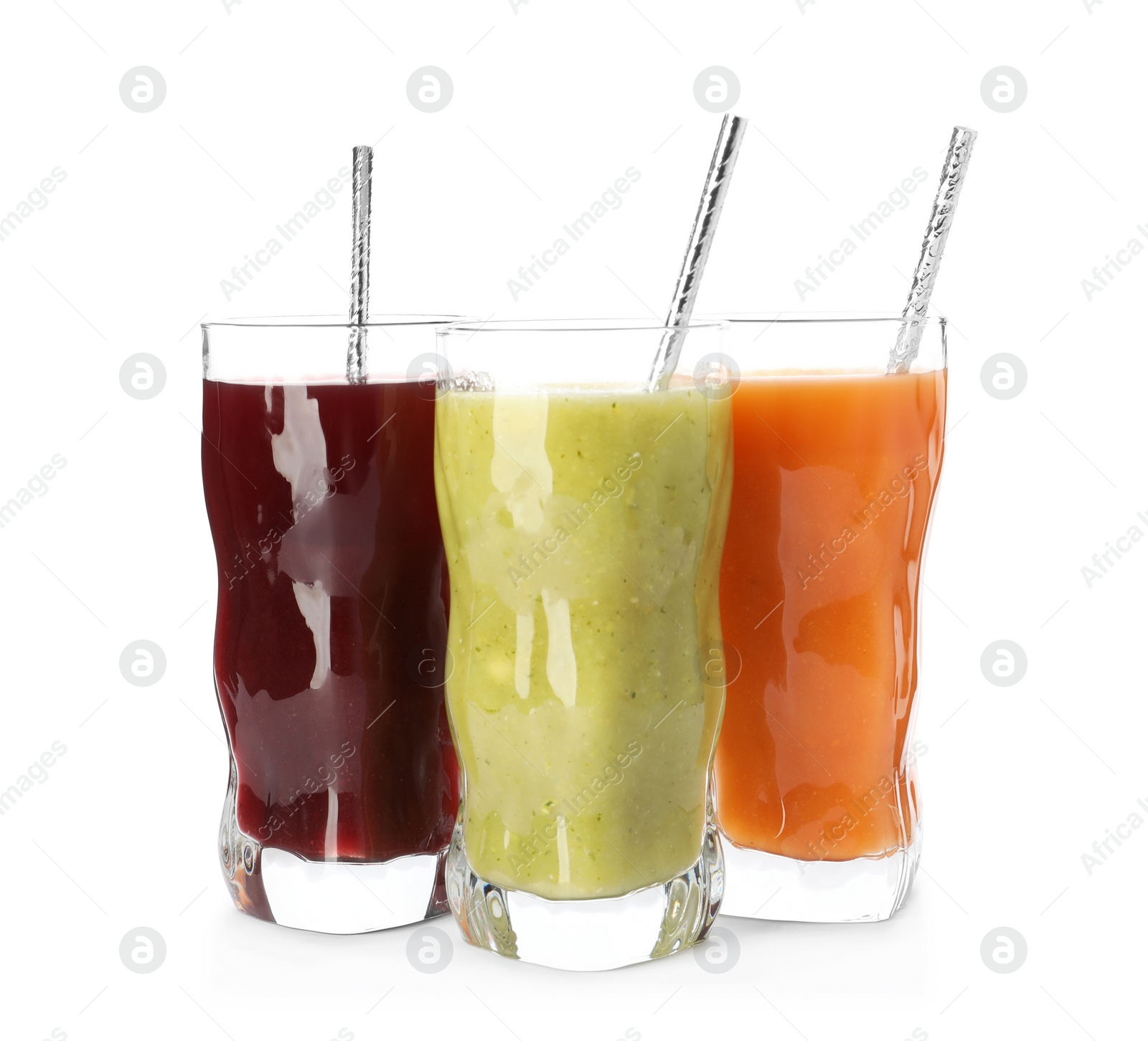 Photo of Delicious colorful juices in glasses isolated on white
