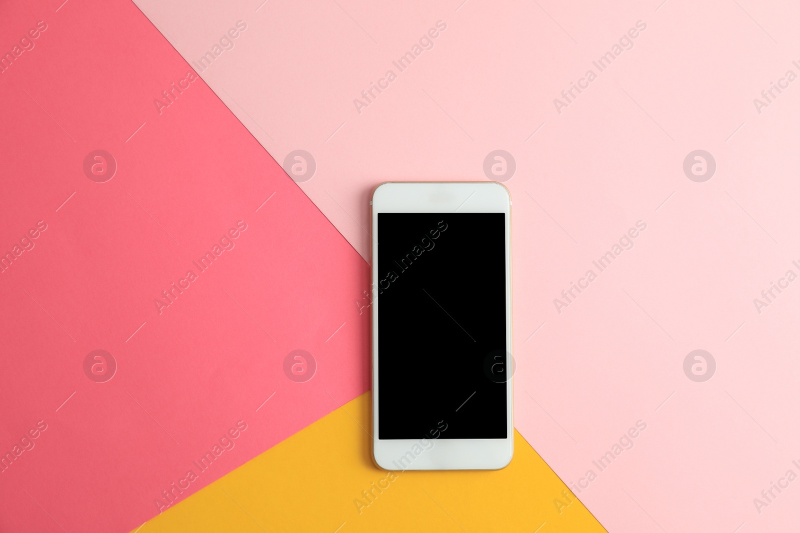 Photo of Modern phone on color background, top view. Space for text