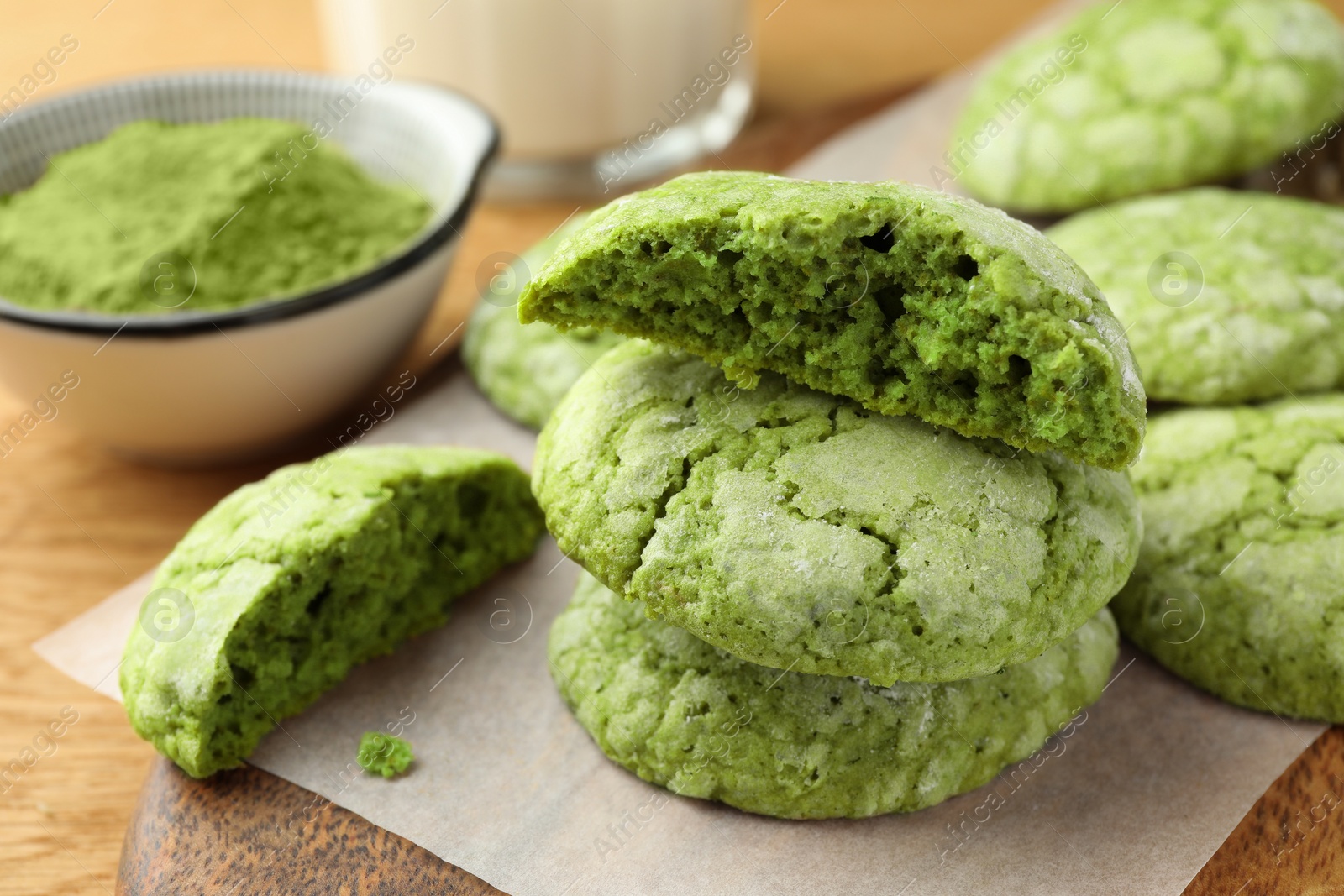 Photo of Tasty matcha cookies on wooden table, closeup