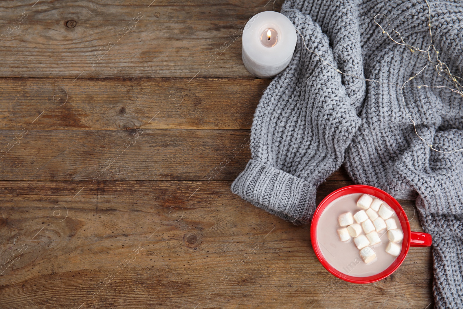 Photo of Flat lay composition with cup of hot cocoa on wooden table, space for text. Winter drink