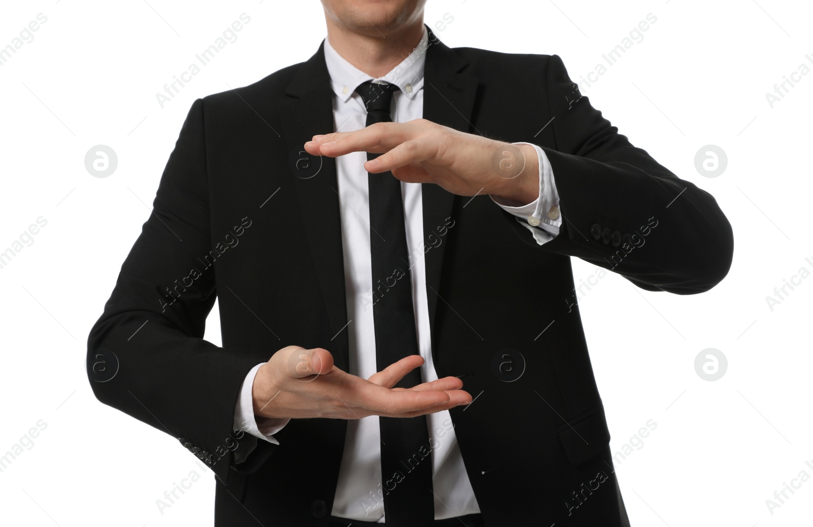 Photo of Businessman holding something on white background, closeup