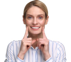 Woman showing her clean teeth and smiling on white background