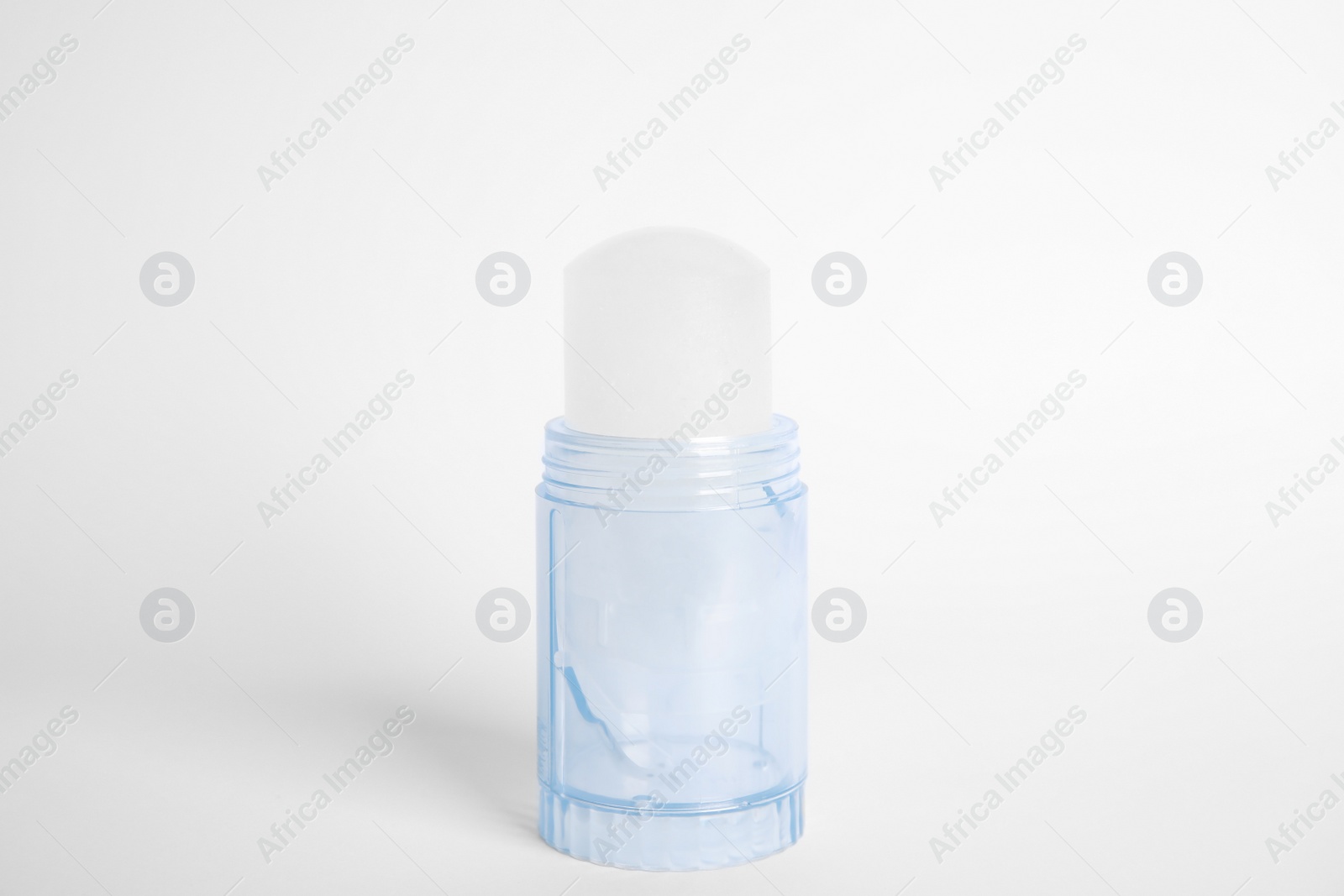 Photo of Natural crystal alum stick deodorant on white background