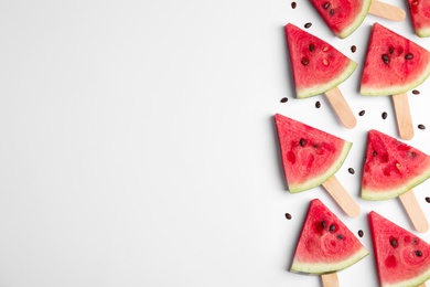 Photo of Slices of ripe watermelon on white background, flat lay. Space for text