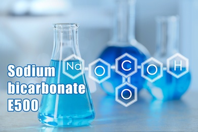 Image of Text Sodium bicarbonate E500 with soda formula and laboratory glassware on background