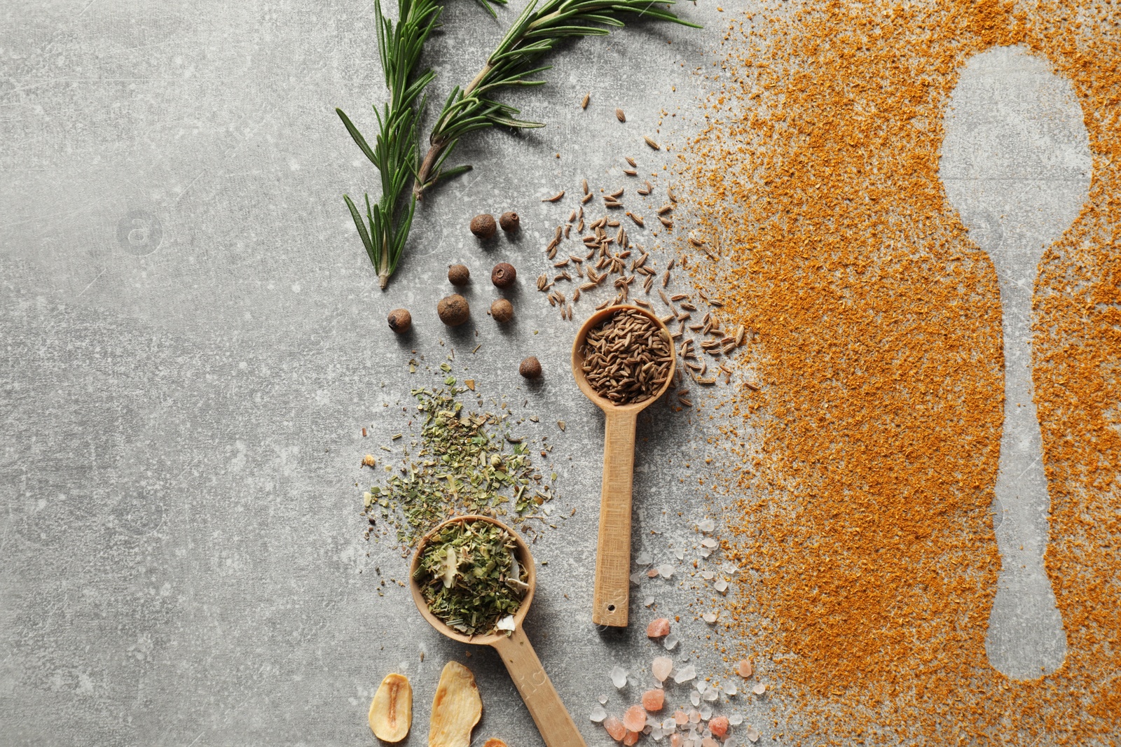 Photo of Different spices and silhouettes of spoon on light grey table, flat lay. Space for text