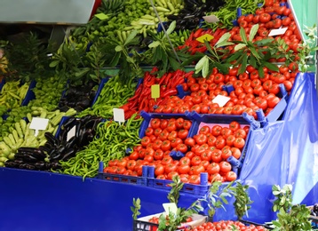 Photo of Tasty fresh vegetables on counter at market