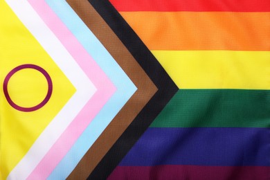 Photo of Bright progress flag as background, closeup. LGBT pride