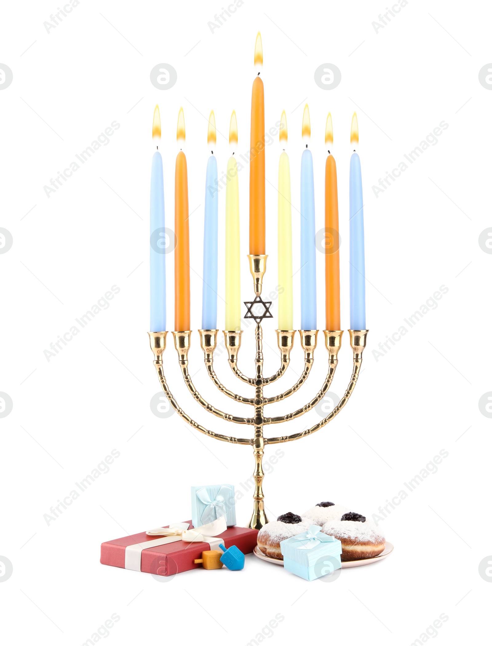 Photo of Hanukkah celebration. Menorah with candles, gift boxes, colorful dreidels and donuts isolated on white