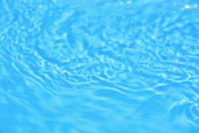 Photo of Blurred view of swimming pool with clean blue water on sunny day