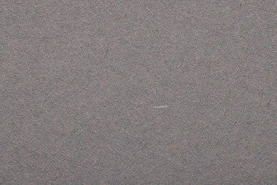 Photo of Texture of grey paper sheet as background, top view