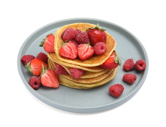 Photo of Tasty pancakes with fresh berries on white background