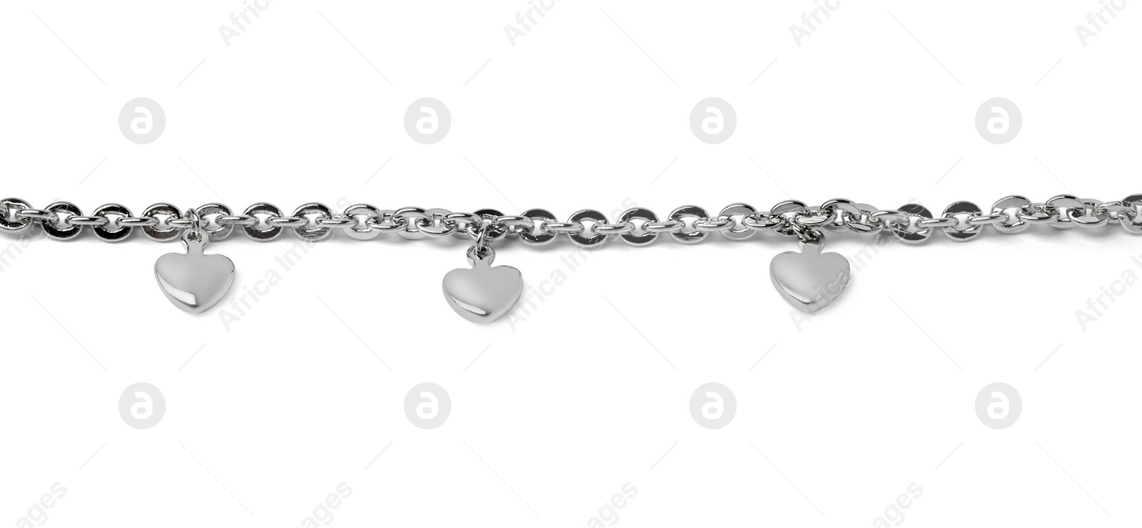 Photo of One metal chain with heart pendants isolated on white. Luxury jewelry