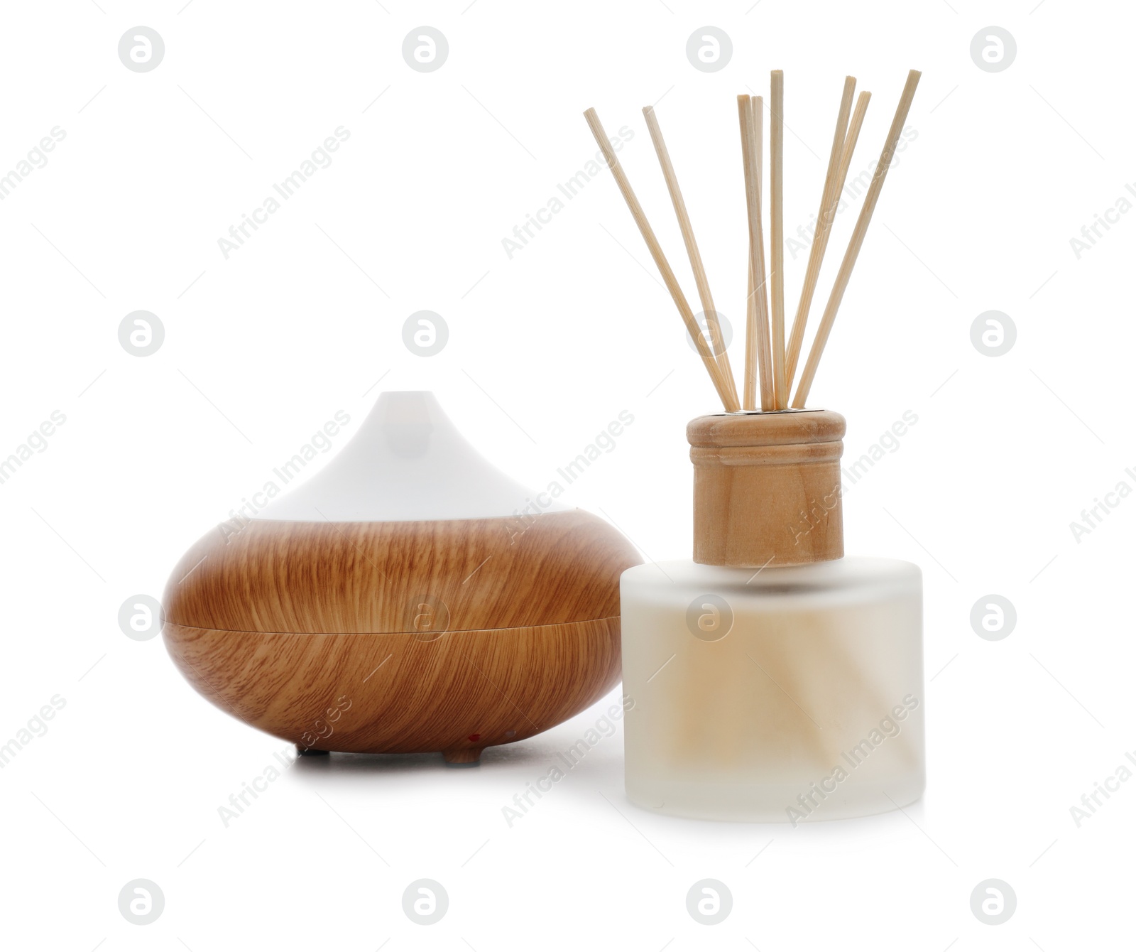 Photo of Aromatic reed freshener and oil diffuser on white background