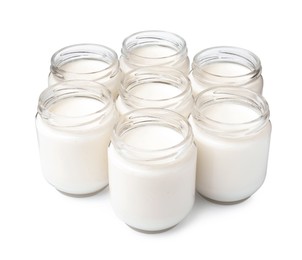 Photo of Glass jars with delicious homemade yogurt on white background