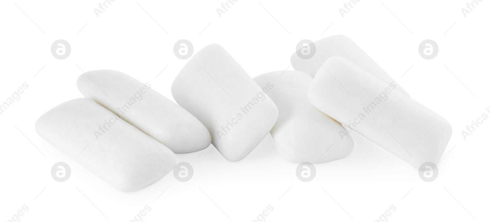 Photo of Pile of tasty chewing gums on white background