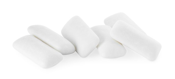 Photo of Pile of tasty chewing gums on white background