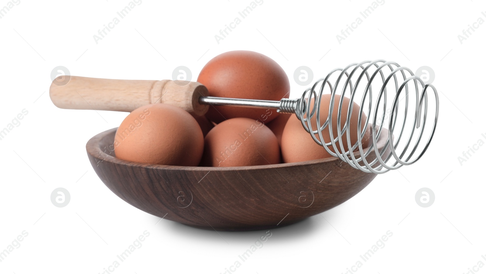 Photo of Whisk and bowl with raw eggs isolated on white