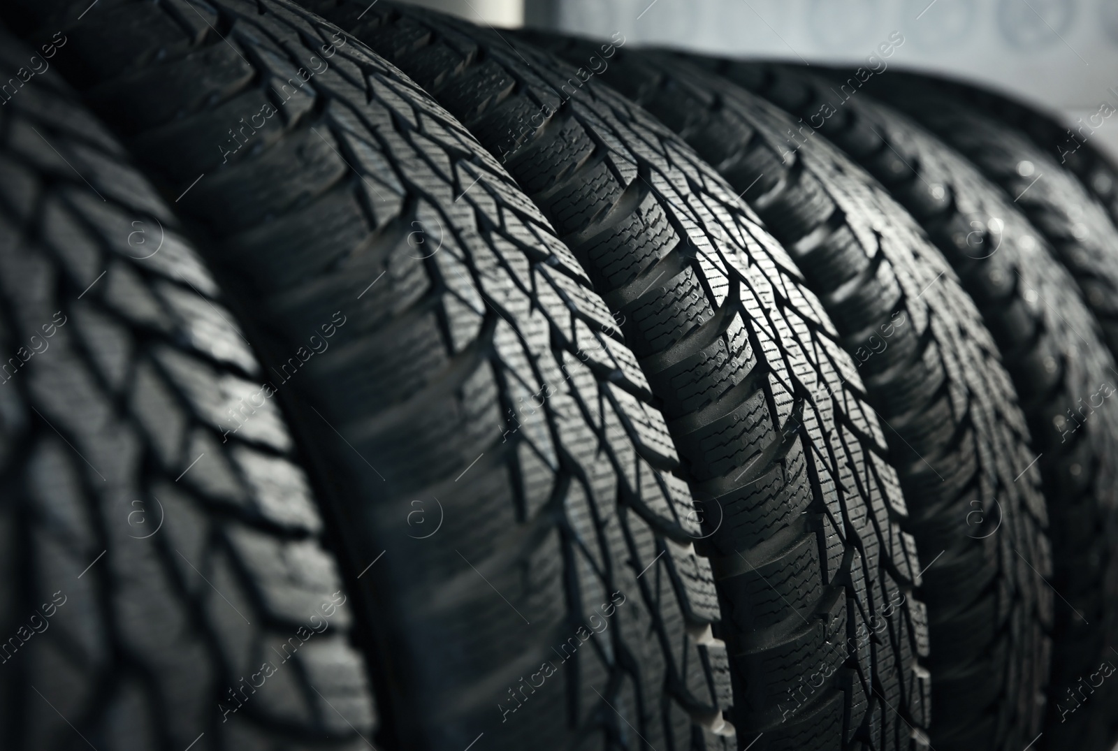 Photo of Car tires in automobile service center, closeup