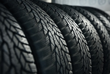 Car tires in automobile service center, closeup