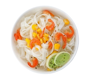 Photo of Bowl with rice noodles, shrimps and vegetables on white background, top view