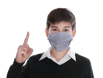 Boy wearing protective mask on white background. Child safety