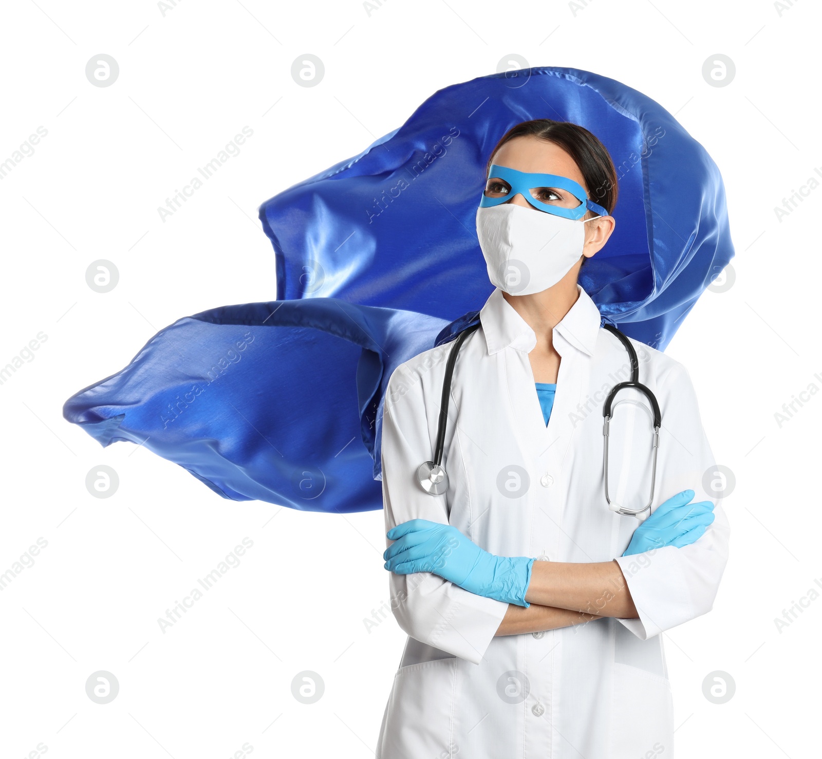 Photo of Doctor dressed as superhero posing on white background. Concept of medical workers fighting with COVID-19