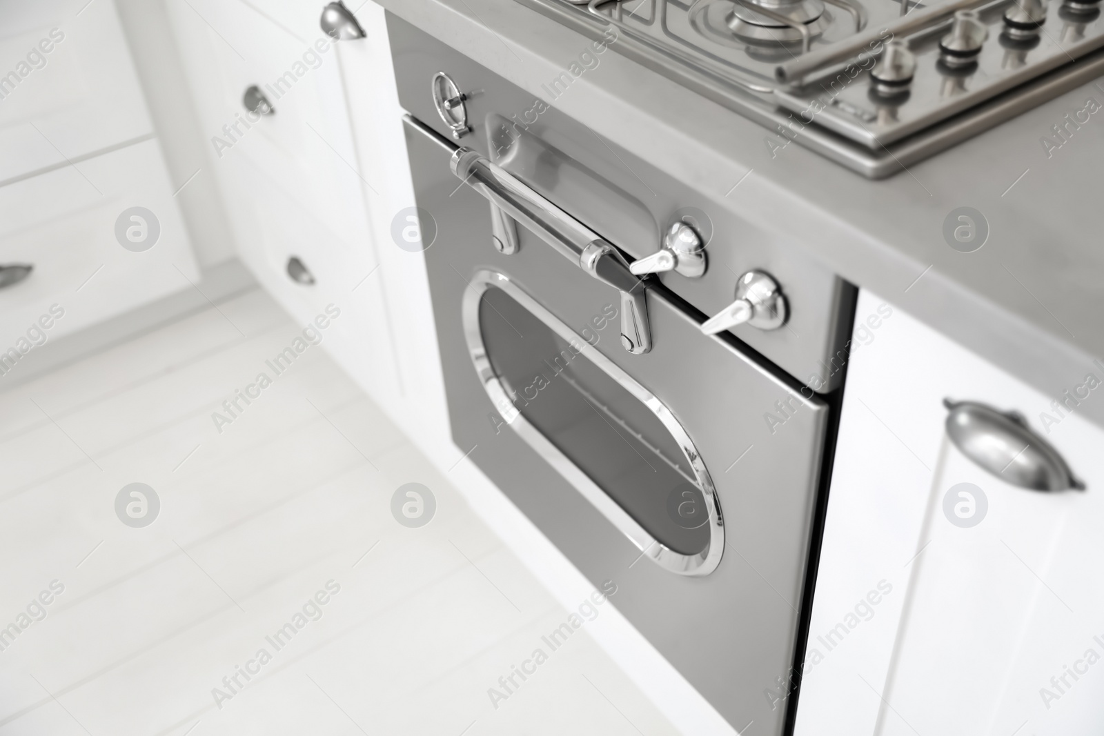 Photo of New modern oven in kitchen, above view